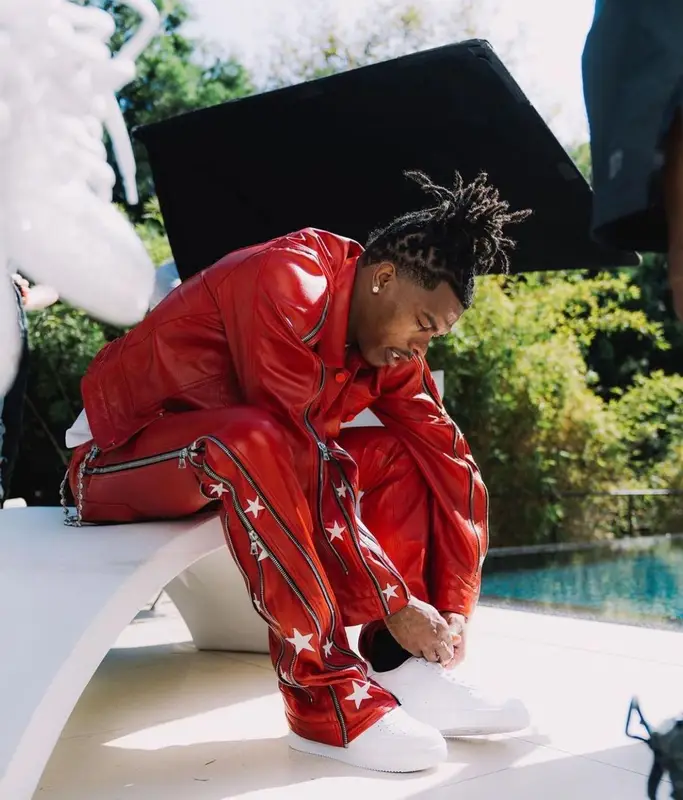 Lil Baby outfit in Cease±Desist, Nike, and Versace, 2022