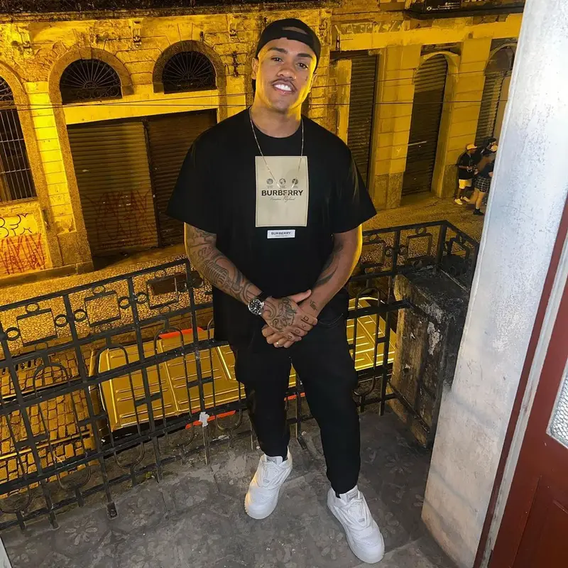 MC Davi outfit in Burberry, Amiri, and Versace, 2022