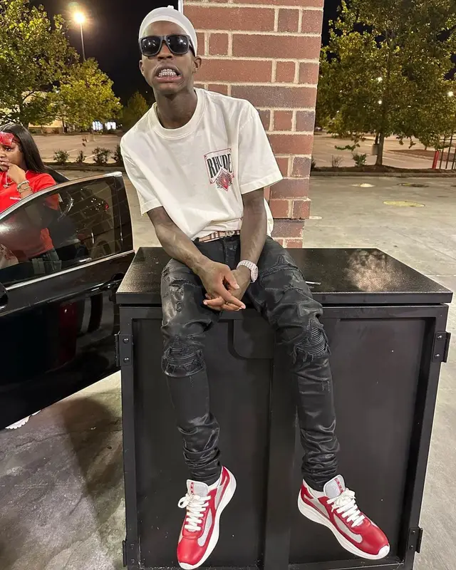 Quando Rondo outfit in Amiri, Prada, and Burberry, 2022