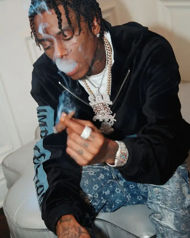 Soulja Boy outfit in Purple Brand, Nike, and Burberry, 2022