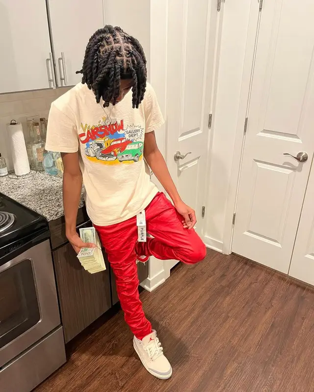 Lil Darius outfit in Gallery Dept., Purple Brand, and Jordan, 2022