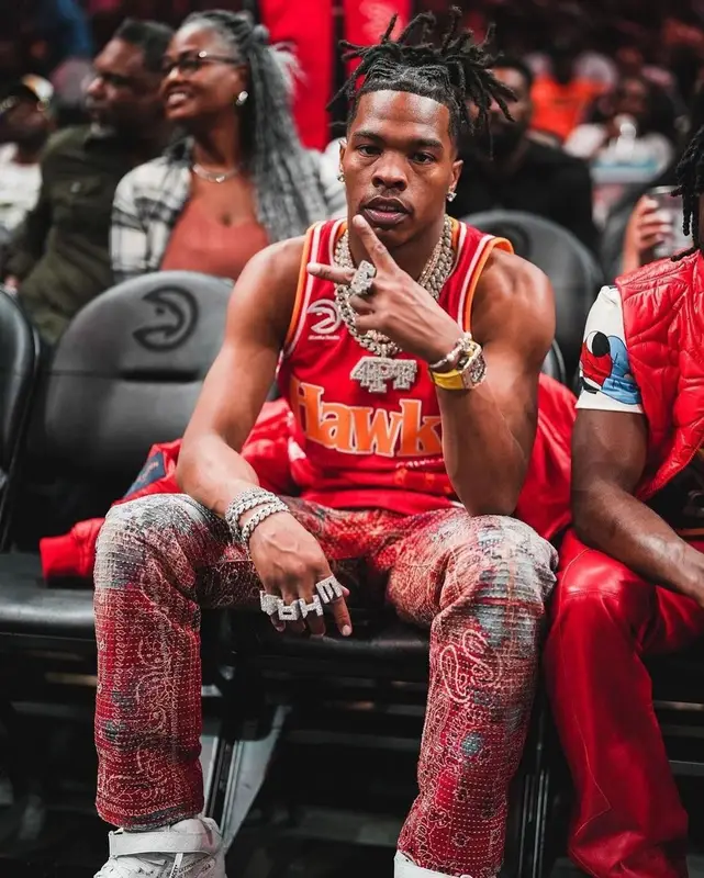 Lil Baby outfit in Atlanta Hawks, Louis Vuitton, and Nike, 2022