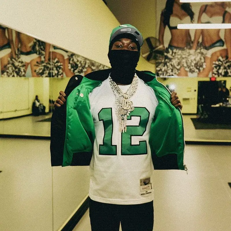 Meek Mill outfit in Bottega Veneta, Mitchell & Ness, and Nike, 2022