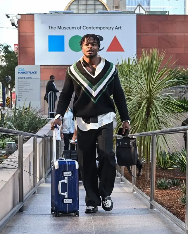 Marquise Goodwin outfit in Loewe, Ami, and Blackstock & Weber, 2022