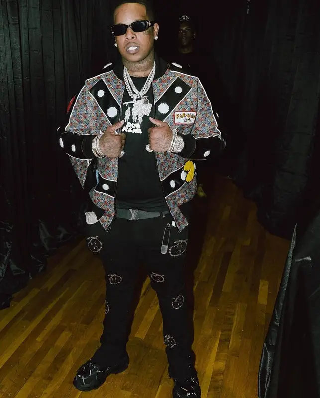 Finesse2tymes outfit in Black Cholo, Balenciaga, and Louis Vuitton, 2022