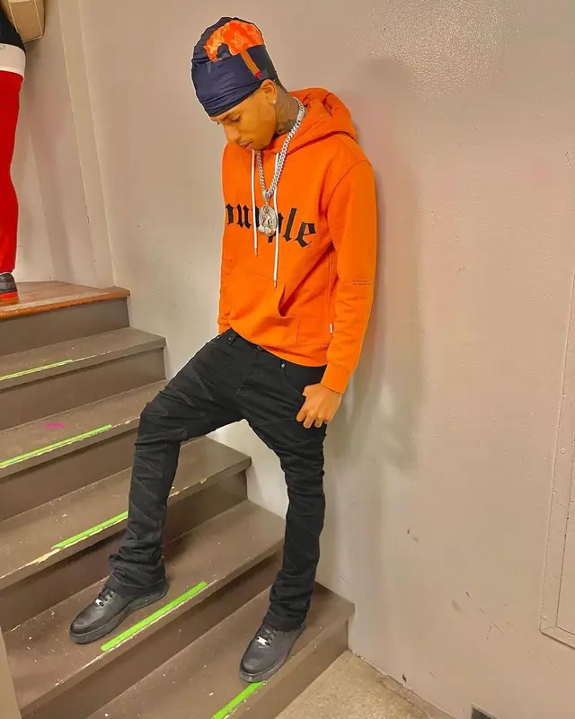 NLE Choppa outfit in Purple Brand, Valabasas, and Nike, 2022