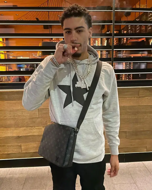 Jay Critch outfit in Amiri, Prada, and Louis Vuitton, 2022