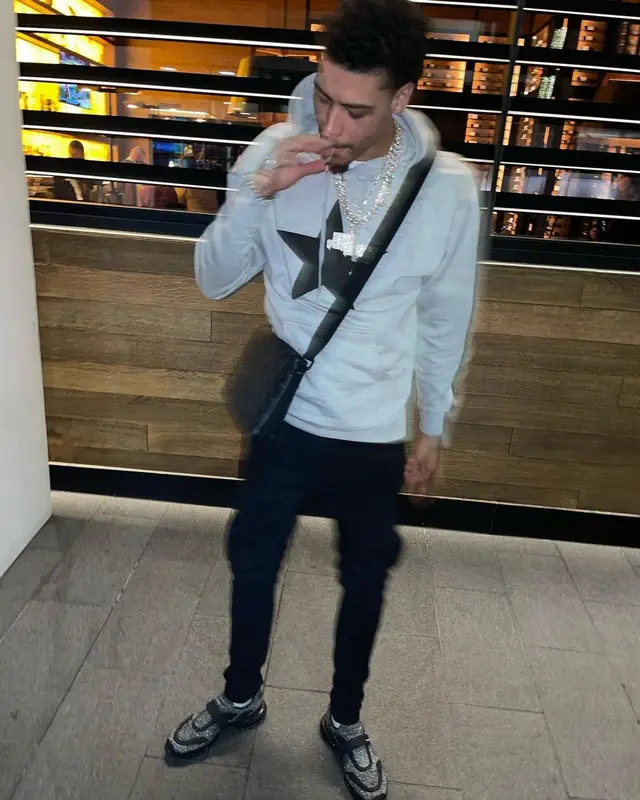 Jay Critch outfit in Amiri, Prada, and Louis Vuitton, 2022