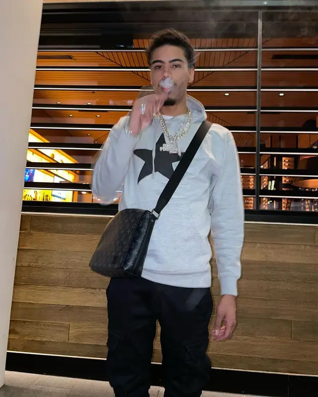 Jay Critch outfit in Amiri, Prada, and Louis Vuitton, 2022