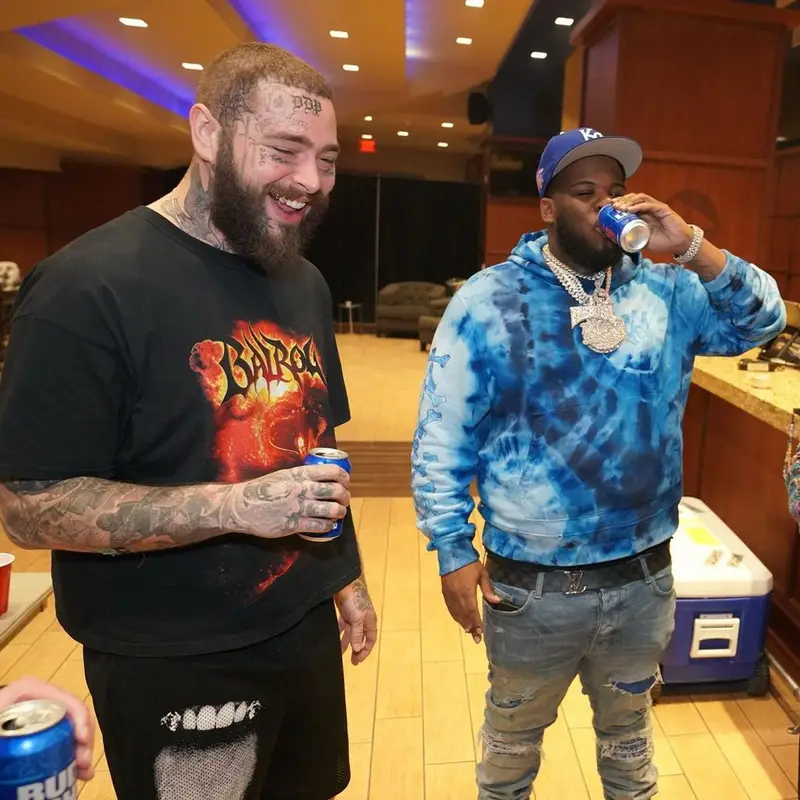 Maxo Kream outfit in Amiri, Louis Vuitton, and New Era, 2022