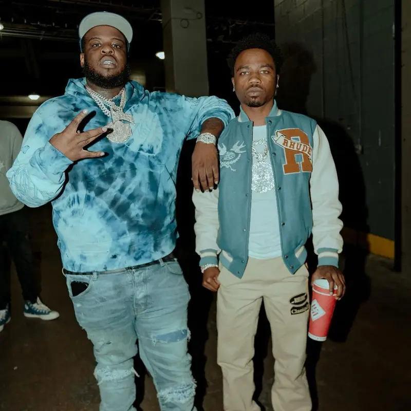 Maxo Kream outfit in Amiri, Louis Vuitton, and New Era, 2022