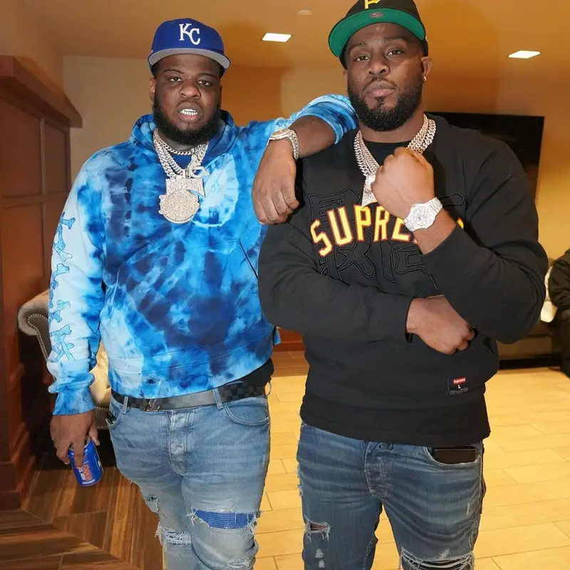 Maxo Kream outfit in Amiri, Louis Vuitton, and New Era, 2022