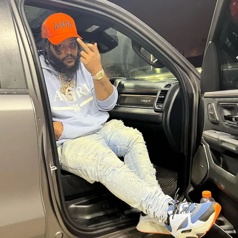 RMC Mike outfit in Dior, Louis Vuitton, and Amiri, 2022
