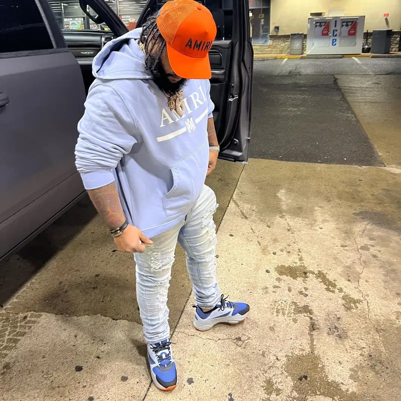 RMC Mike outfit in Dior, Louis Vuitton, and Amiri, 2022