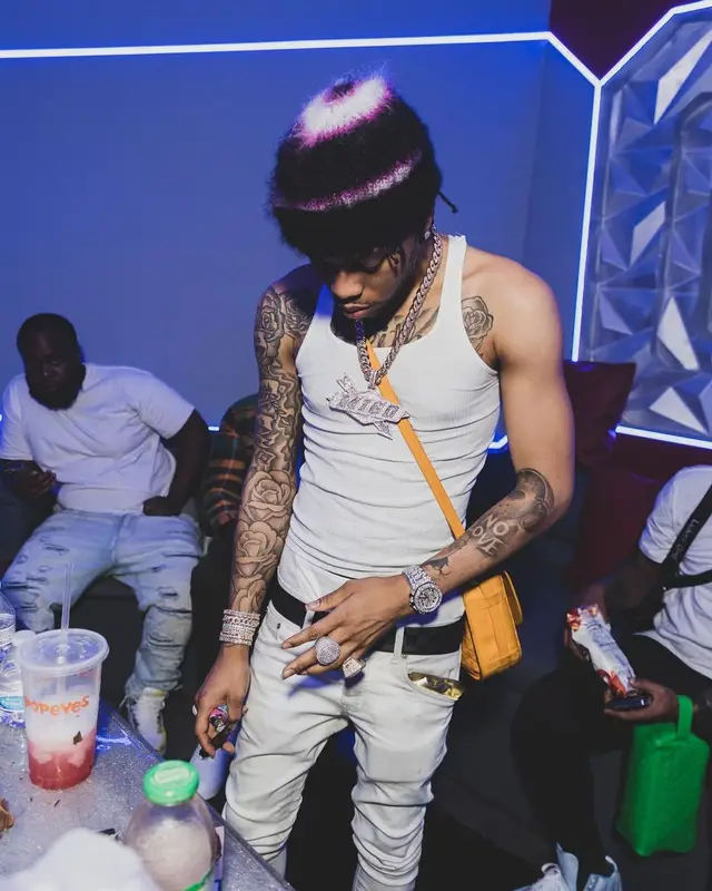 Lil Migo outfit in Louis Vuitton, Goyard, and Marni, 2022