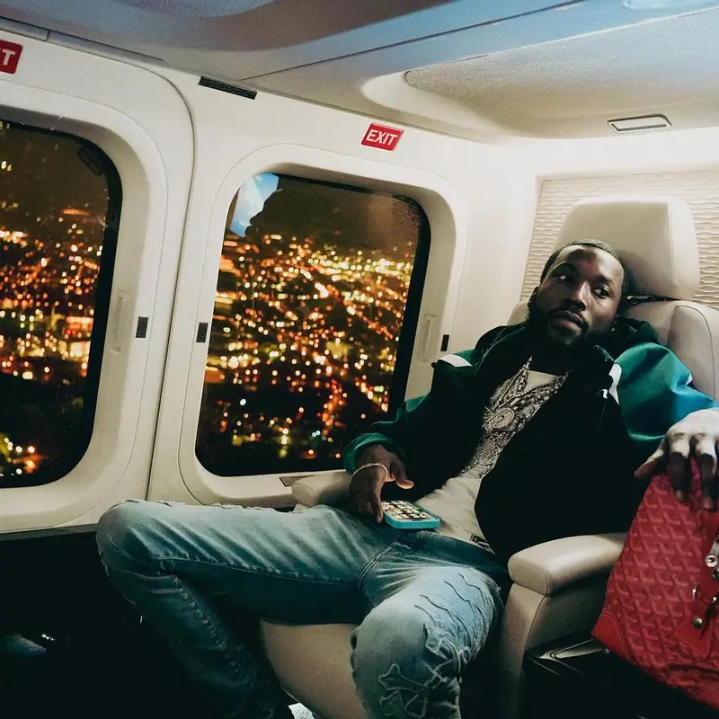 Meek Mill outfit in Louis Vuitton, Amiri, and Nike, 2022