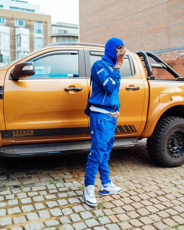 Russ Millions outfit in Jordan, Louis Vuitton, and Trapstar, 2022
