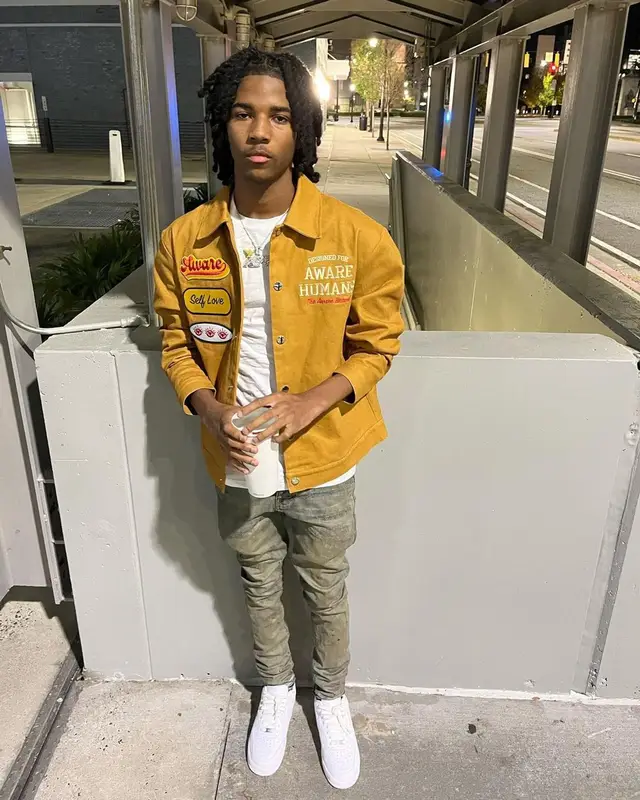 Lil Darius outfit in The Aware Brand, Purple Brand, and Nike, 2022