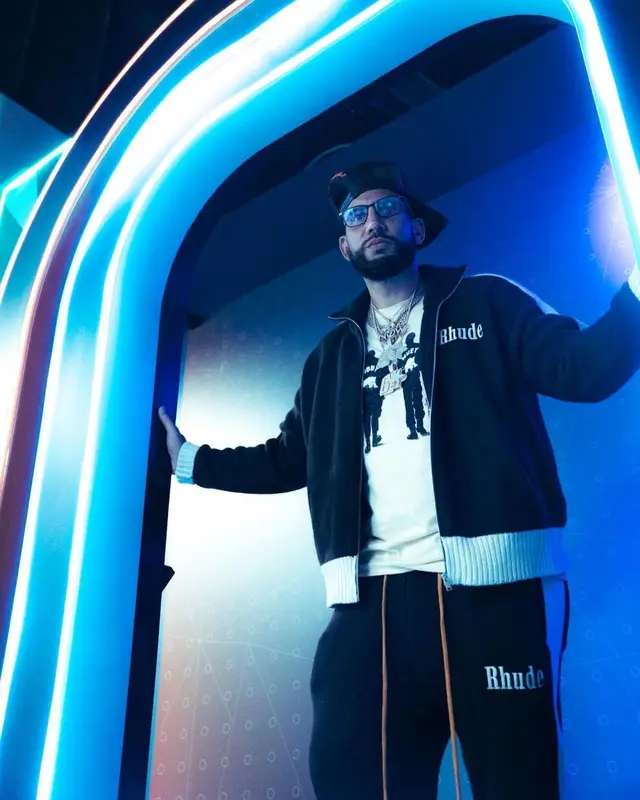 DJ Drama outfit in Rhude, Nike, and Travis Scott Merch, 2022