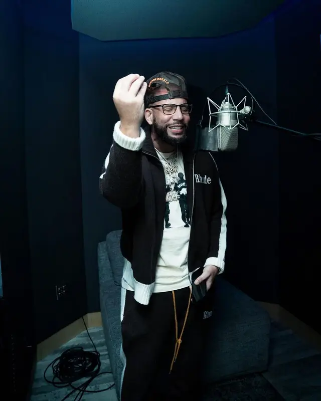 DJ Drama outfit in Rhude, Nike, and Travis Scott Merch, 2022