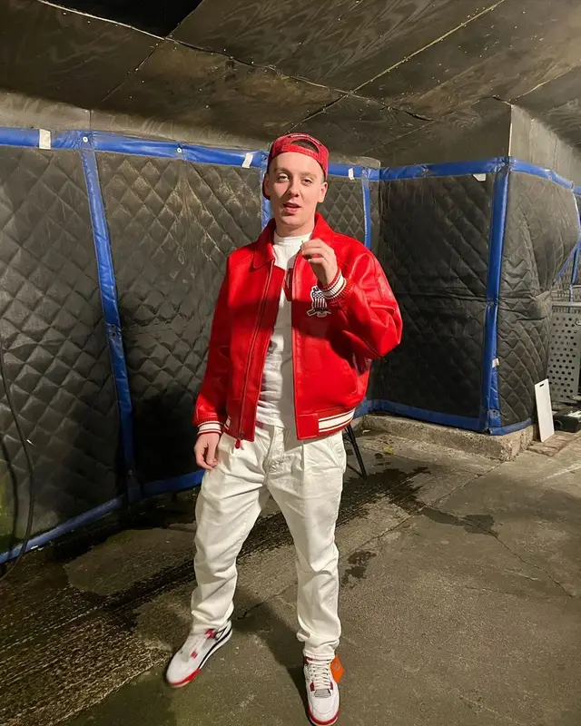Aitch outfit in Avirex, Chrome Hearts, and Matty Boy, 2022
