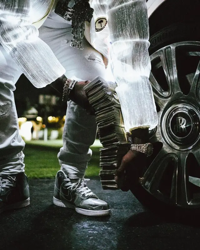 Finesse2tymes outfit in Moncler, Amiri, and Palm Angels, 2022