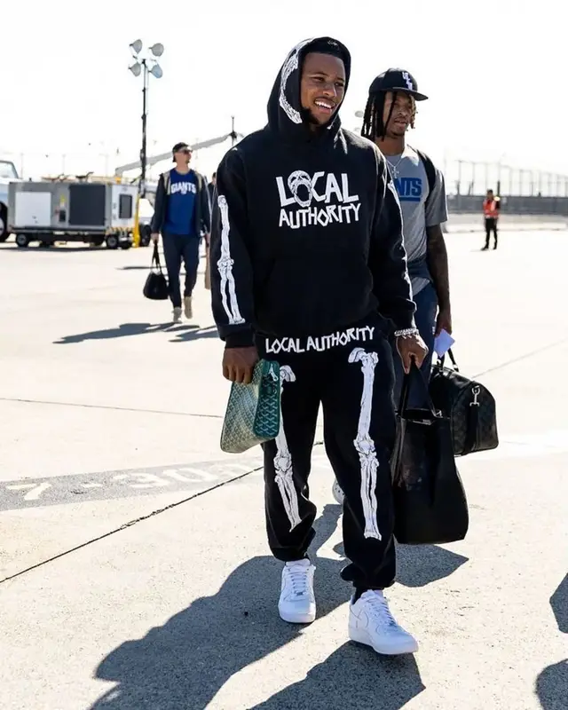 Saquon Barkley outfit in Local Authority LA, Nike, and Goyard, 2022