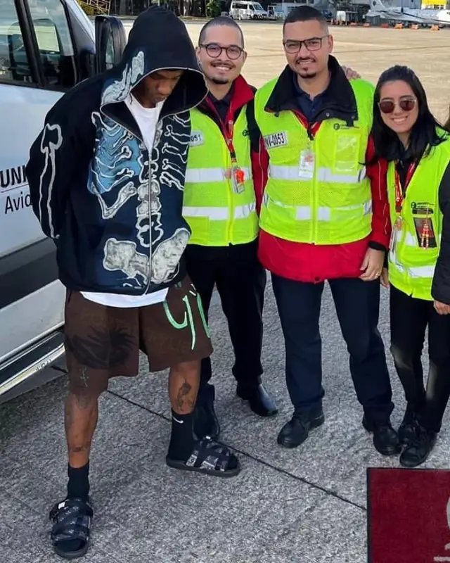 Travis Scott outfit in Travis Scott Merch, Fragment, and Louis Vuitton, 2022