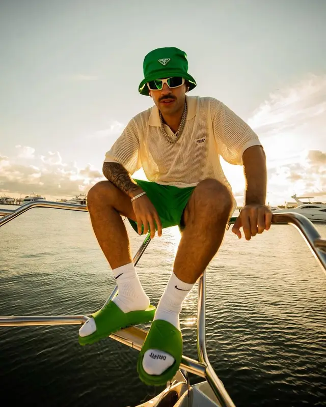Feid outfit in Oakley, Prada, and Nike, 2022