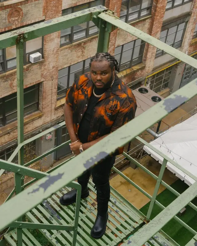 Tee Grizzley outfit in Prada, Amiri, and Bottega Veneta, 2022