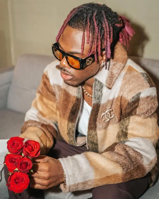 CKay outfit in Nike, Gucci, and Chanel, 2022