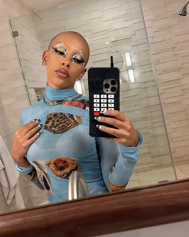 Doja Cat outfit in Acne Studios and Arms of Eve, 2022