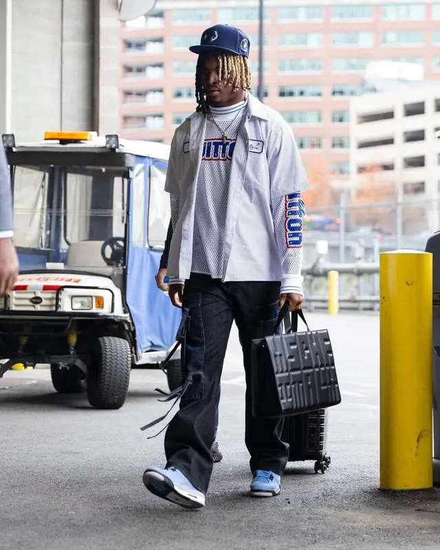 Xavier McKinney outfit in Peels, Louis Vuitton, and Jordan, 2022
