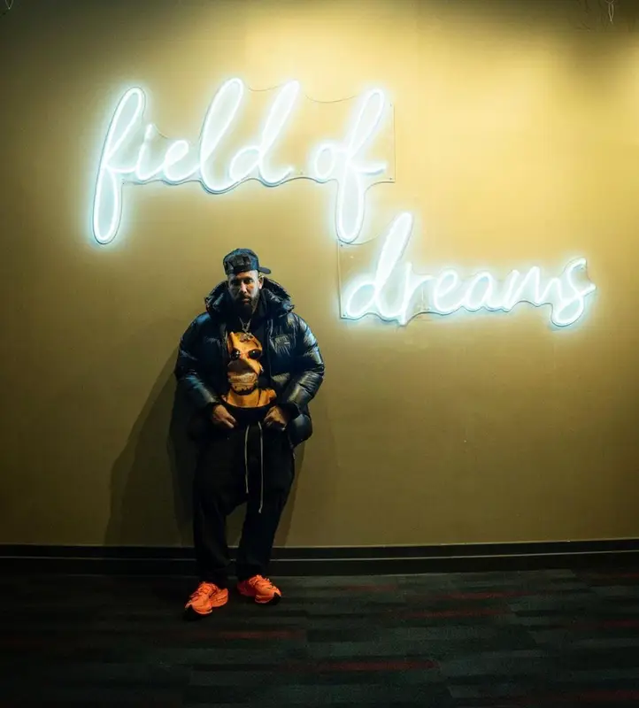 DJ Drama outfit in Purple Brand, Vlone, and Amiri, 2022