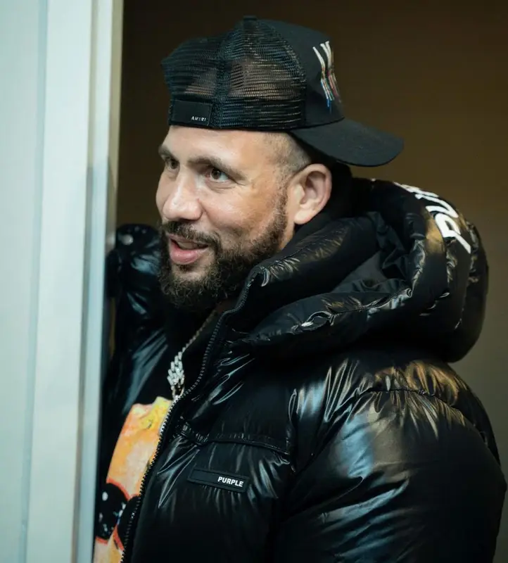 DJ Drama outfit in Purple Brand, Vlone, and Amiri, 2022