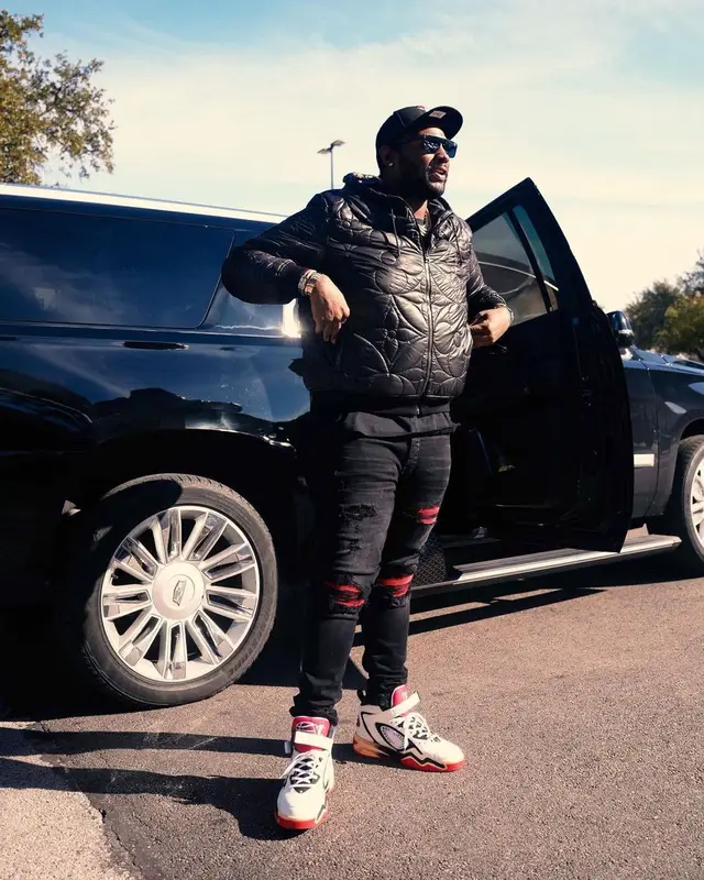 Peezy outfit in Goyard, Louis Vuitton, and New Era, 2022