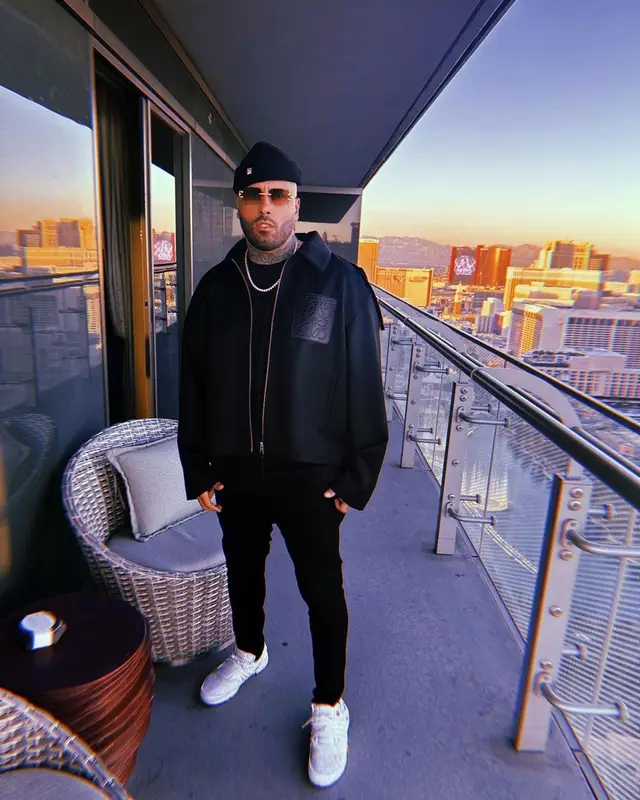 Nicky Jam outfit in Loewe, Nike, and Cartier, 2022