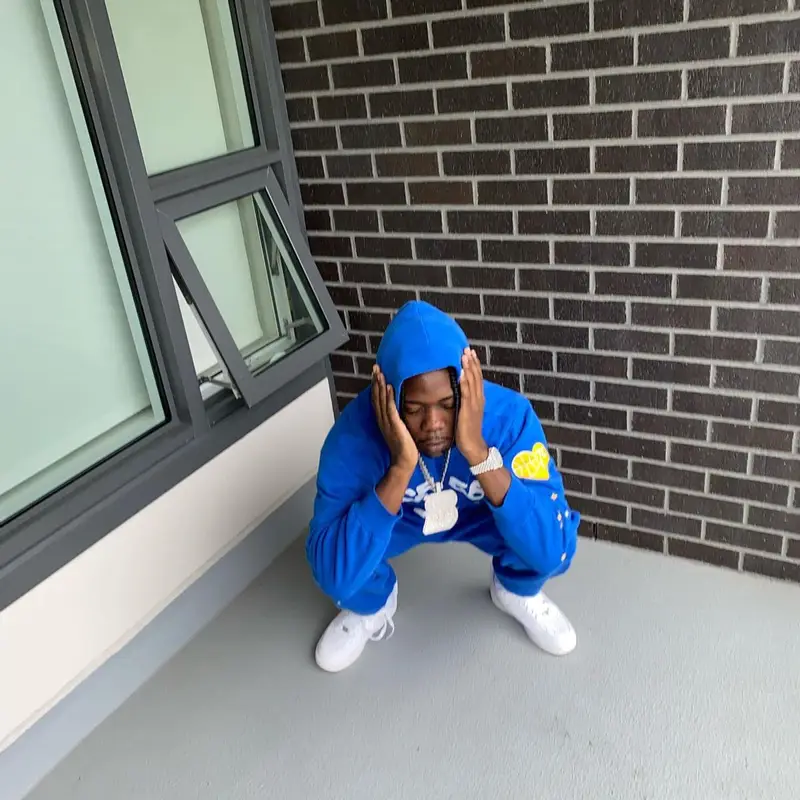Burna Bandz outfit in Spider Worldwide and Nike, 2022