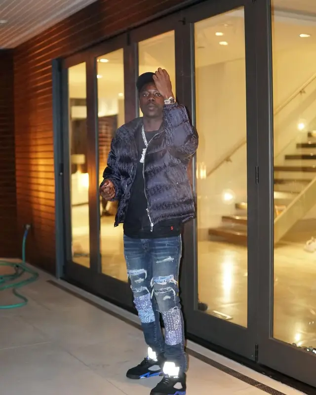 Burna Bandz outfit in Dior, Polo Ralph Lauren, and Amiri, 2022