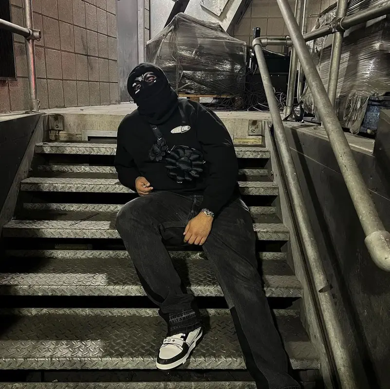 M Huncho outfit in Jeanius Bar Atelier, Louis Vuitton, and Takashi Murakami, 2022