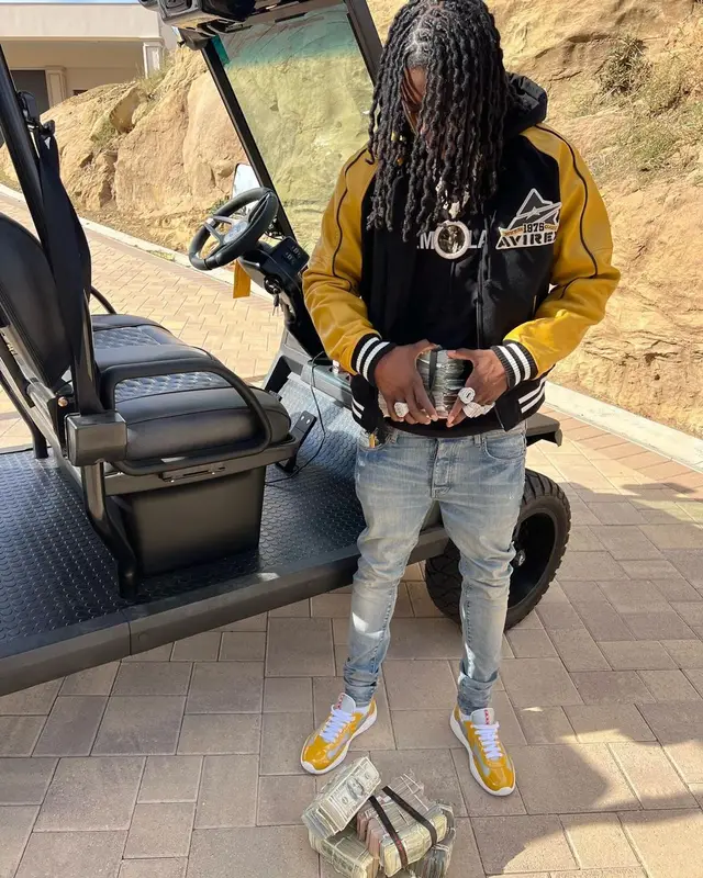 Polo G outfit in Avirex, Helmut Lang, and Amiri, 2022