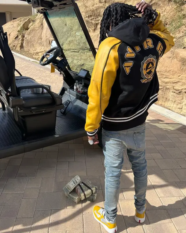 Polo G outfit in Avirex, Helmut Lang, and Amiri, 2022