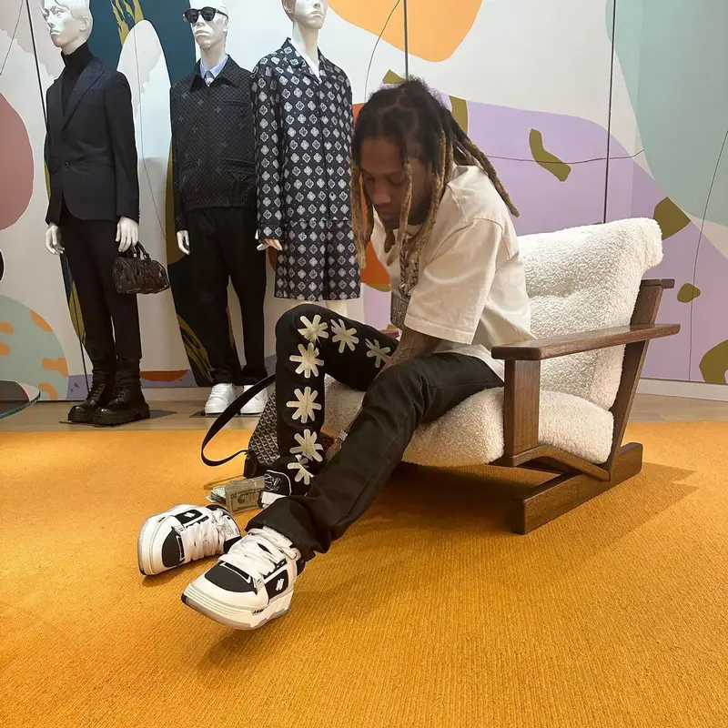 Lil Durk outfit in Louis Vuitton, Goyard, and Amiri, 2022