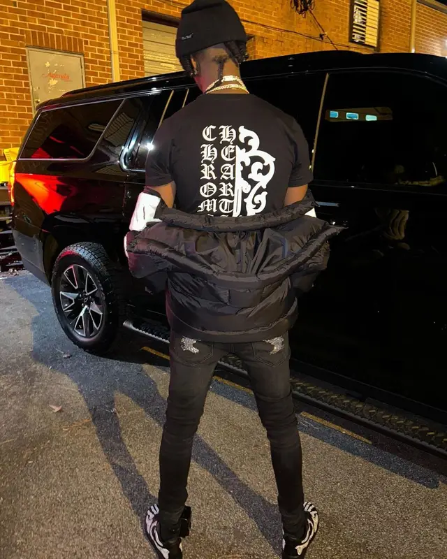 Yung Mal outfit in Chrome Hearts, Versace, and Don Honcho, 2022