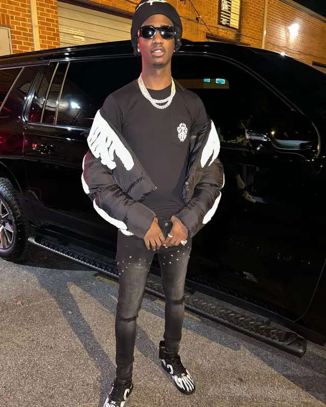 Yung Mal outfit in Chrome Hearts, Versace, and Don Honcho, 2022