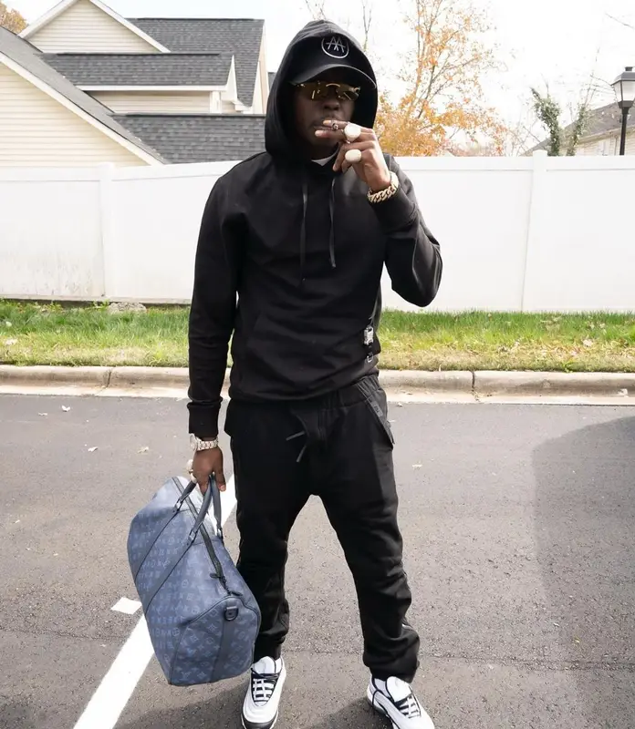 Bobby Shmurda outfit in Alyx, Louis Vuitton, and Cartier, 2022