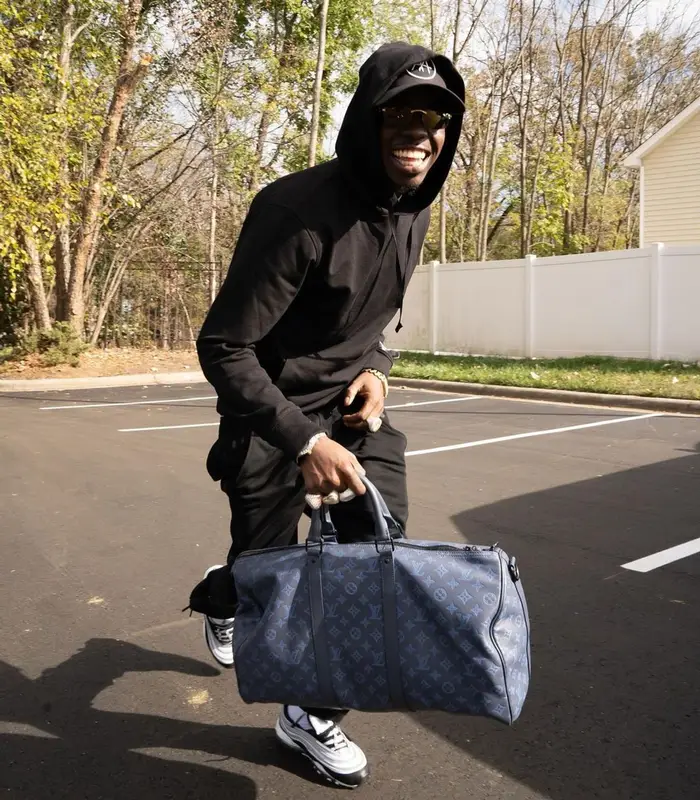 Bobby Shmurda outfit in Alyx, Louis Vuitton, and Cartier, 2022