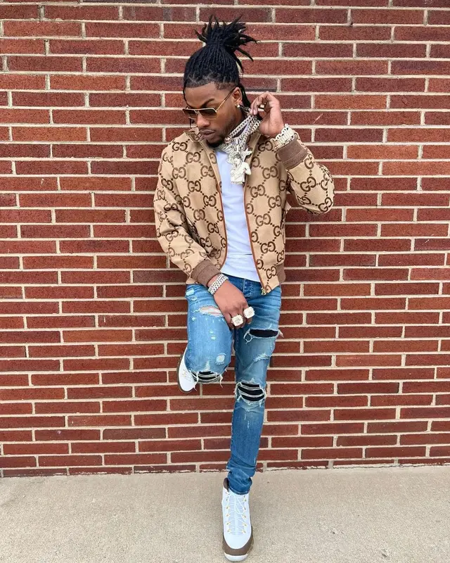 CJ So Cool outfit in Gucci, Amiri, and Louis Vuitton, 2022