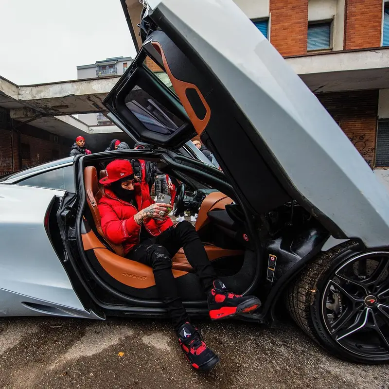 Sfera Ebbasta outfit in Prada, Louis Vuitton, and New Era, 2022