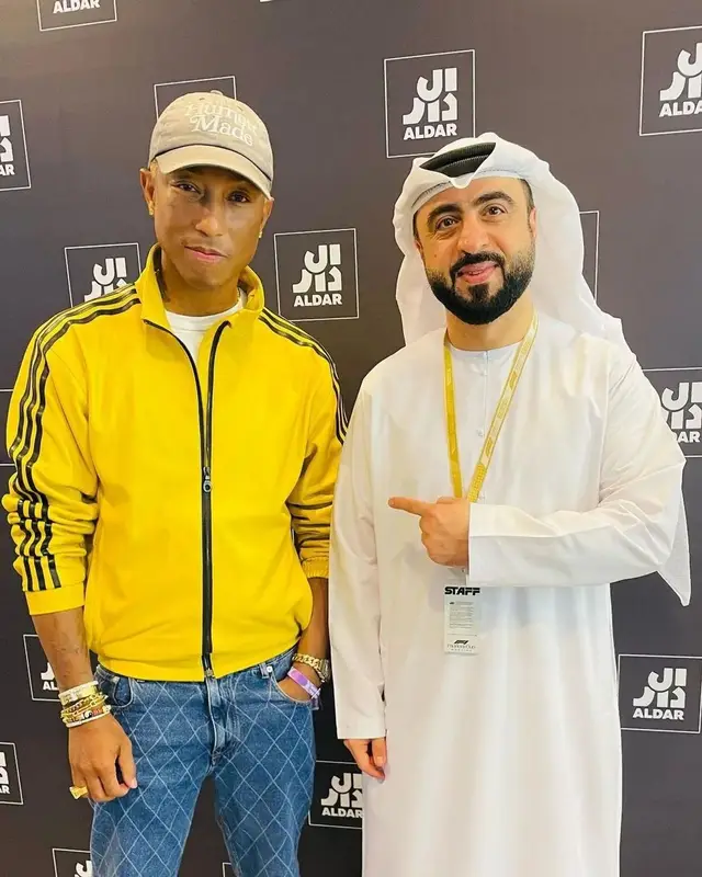 Pharrell Williams outfit in Adidas, Human Made, and Girls Don't Cry, 2022